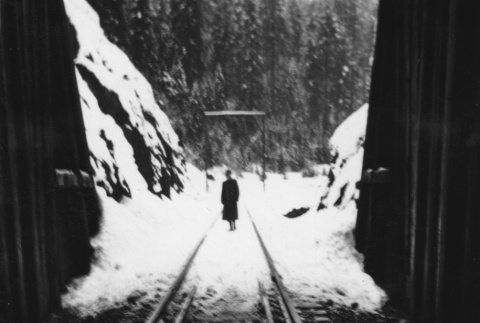 Man standing at entrance to railway tunnel (ddr-ajah-2-779)