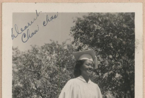 Signed photograph of a woman in a graduation cap and gown (ddr-manz-10-70)