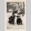Claude and Junior Morita with dogs in snow (ddr-densho-409-53)