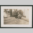 two men and one woman sitting on a deck (ddr-densho-378-774)