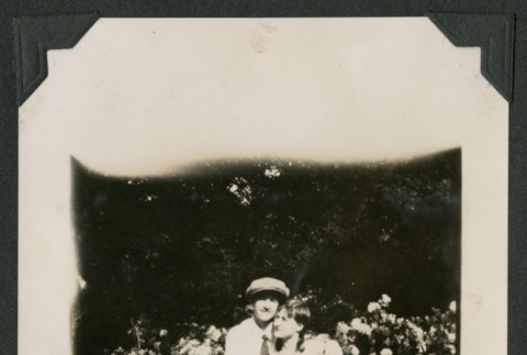 man and woman sitting on garden bench (ddr-densho-378-493)