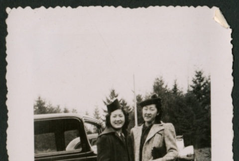 Two women in front of car (ddr-densho-359-204)