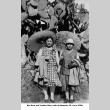 Two women with parasols next to large nopal cactus (ddr-ajah-6-927)