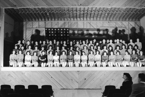 Minidoka High School students seated on an auditorium stage (ddr-fom-1-477)
