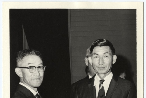 Man handing out award to John Kurazawa (ddr-jamsj-1-640)