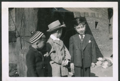 Photo of three children in suits (ddr-densho-483-349)