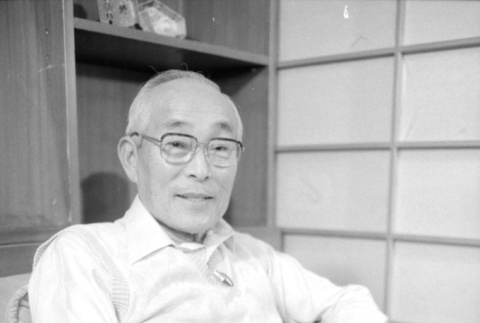 Portrait of man in white sweater (ddr-densho-1007-574)