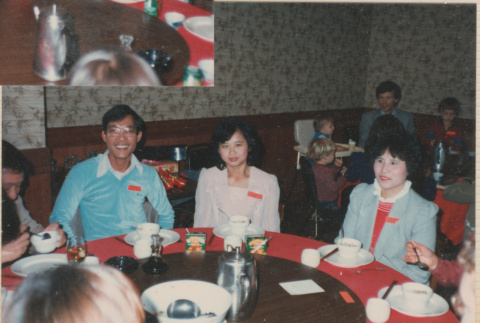 Three people sitting at a table (ddr-densho-426-2222)