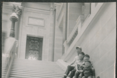David, Chester Jr., Gerald and Norman Sakura sitting on steps of Wisconsin State Capitol Building (ddr-densho-523-225)