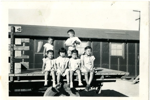 Children on a truck bed (ddr-manz-6-55)