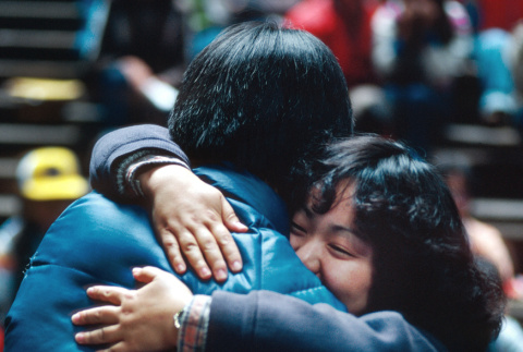 Ann Shimakawa hugging a fellow camper (ddr-densho-336-1371)