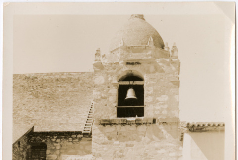 Four people sitting outside Carmel Mission Church (ddr-densho-426-1977)