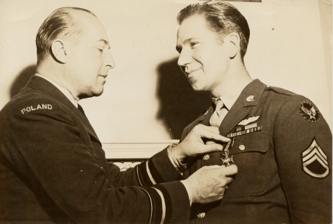 Staff Sergeant Sylvester F. Dudek receiving the Polish Virtuti Militari award (ddr-njpa-1-178)