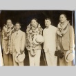 John H. Wilson posing with men wearing leis (ddr-njpa-2-909)