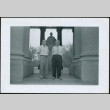 Two men standing by monument (ddr-densho-293-183)
