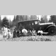 Nisei youth relaxing in front of car (ddr-densho-134-17)