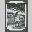 Shirtless man packing fruit into a crate (ddr-densho-471-168)