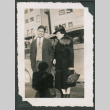 Photo of a man and woman beside a car (ddr-densho-483-361)