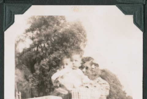 Blurry photo of a woman holding a child (ddr-densho-483-945)