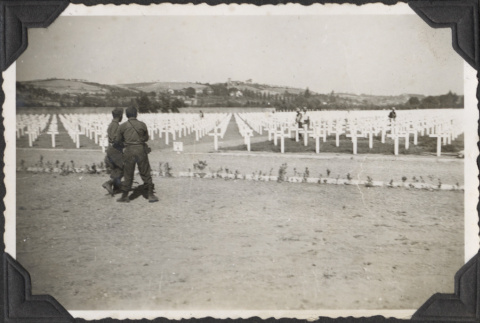 Two men looking out at cemetery at Castelfiorentino (ddr-densho-466-692)