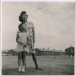 A Japanese American woman and girl look up into the sky (ddr-densho-362-4)