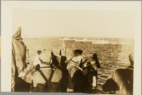 Italian sailors looking out from the deck of their ship (ddr-njpa-13-758)