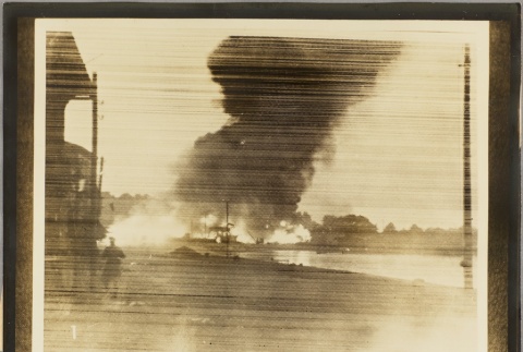 Photograph of a fire caused by a bombing (ddr-njpa-13-1085)