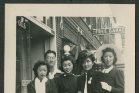 Four women and a man pose on sidewalk (ddr-densho-359-177)