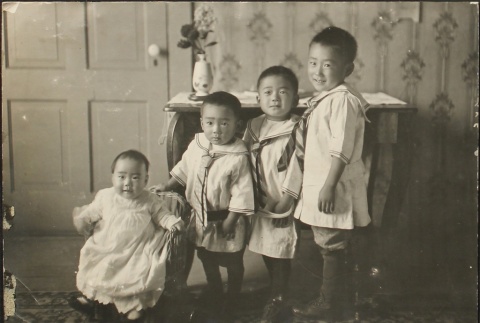 Four Nisei children at home (ddr-densho-259-129)