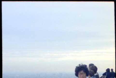 Martha (Nozawa) Tsuchida at railing of Eiffel Tower (ddr-densho-426-708)