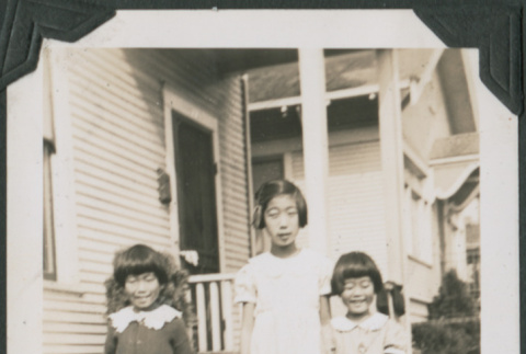 Three girls and a boy with toy car (ddr-densho-355-554)