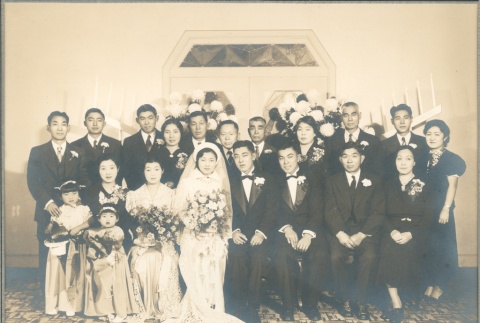Group of people seated and standing for wedding (ddr-densho-332-48)