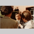Gordon Hirabayashi being interviewed outside the courthouse (ddr-densho-10-75)