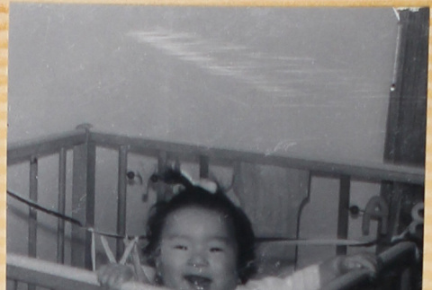 Baby in crib (ddr-densho-522-29)