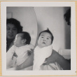 Yoshiko Shiomi holding Leslie Shiomi with mirror reflection (ddr-densho-522-347)