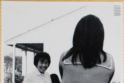 Two women outside house (ddr-densho-522-87)