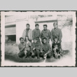 Seven Soldiers pose with two girls and a dog (ddr-densho-368-535)