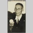 Kumaji Hanatani holding a baseball (ddr-njpa-5-1231)