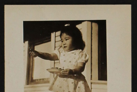 Child with food (ddr-densho-287-516)
