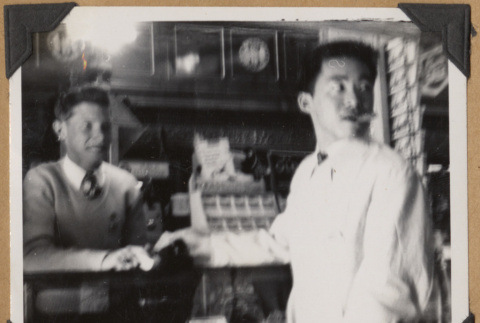 Two men at The Owl Drug Co. (ddr-densho-542-162)