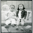 Photograph of children sitting on a bench at Manzanar (ddr-csujad-47-215)
