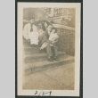 family sitting on steps (ddr-densho-378-549)