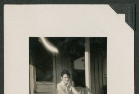 woman sitting on porch (ddr-densho-378-661)