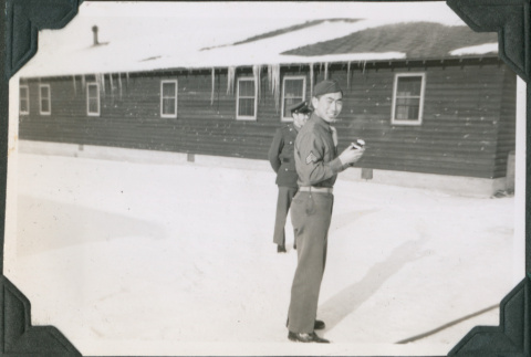 Two men standing in snow (ddr-ajah-2-472)