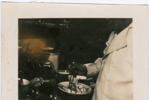 Man with plate of food (ddr-densho-426-1934)