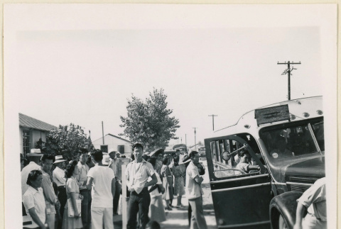 Crowd outside a bus (ddr-densho-37-1472)