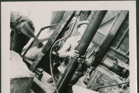 Man holding support post (ddr-densho-426-2258)