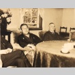 Men seated at a table (ddr-njpa-4-83)