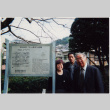 Tomoye, Norman and Henri Takahashi standing by sign for Siebold Residence, Nagasaki (ddr-densho-426-532)