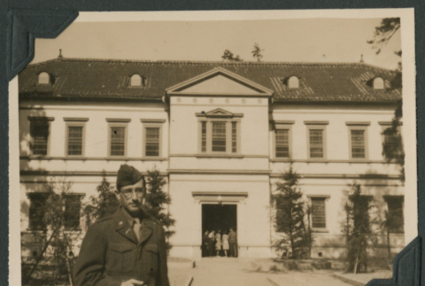 Lieutenant poses outside officers' quarters (ddr-densho-397-136)